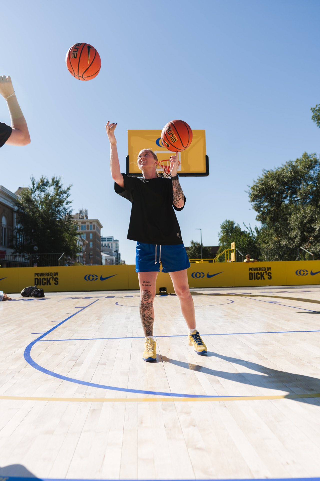 Hannah Mortimer spinning a basketball on an outdoor court